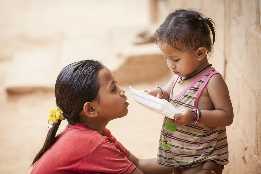 travel photography-Children having a poor meal in a small village in Northern Laos